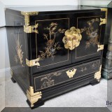 F46. Black lacquer Chinoiserie cabinet with brass fittings. 24”h x 24”w x 18”d